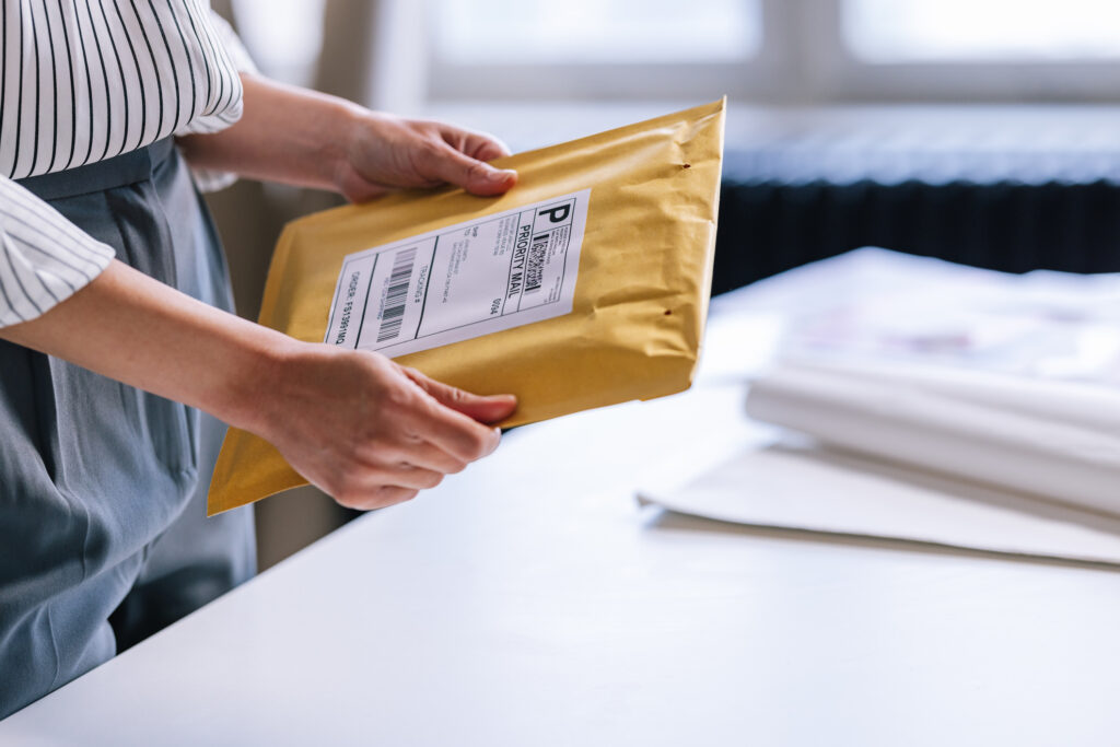 Business woman sending document for apostille.